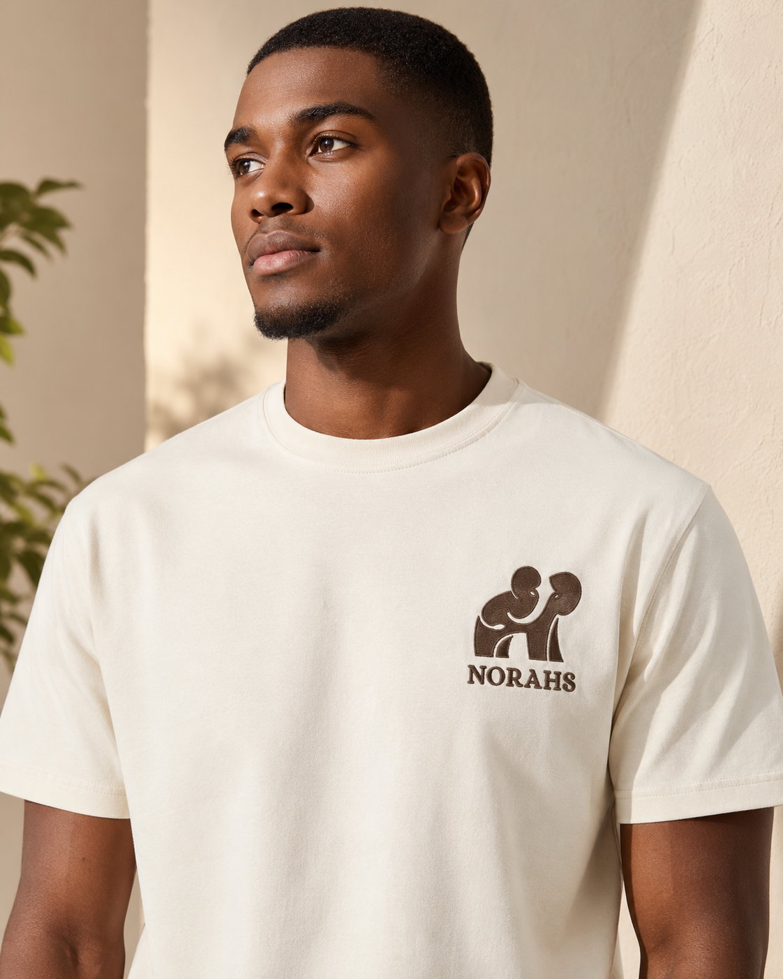 Younger Man wearing the natural Signature Supima Tee, front view