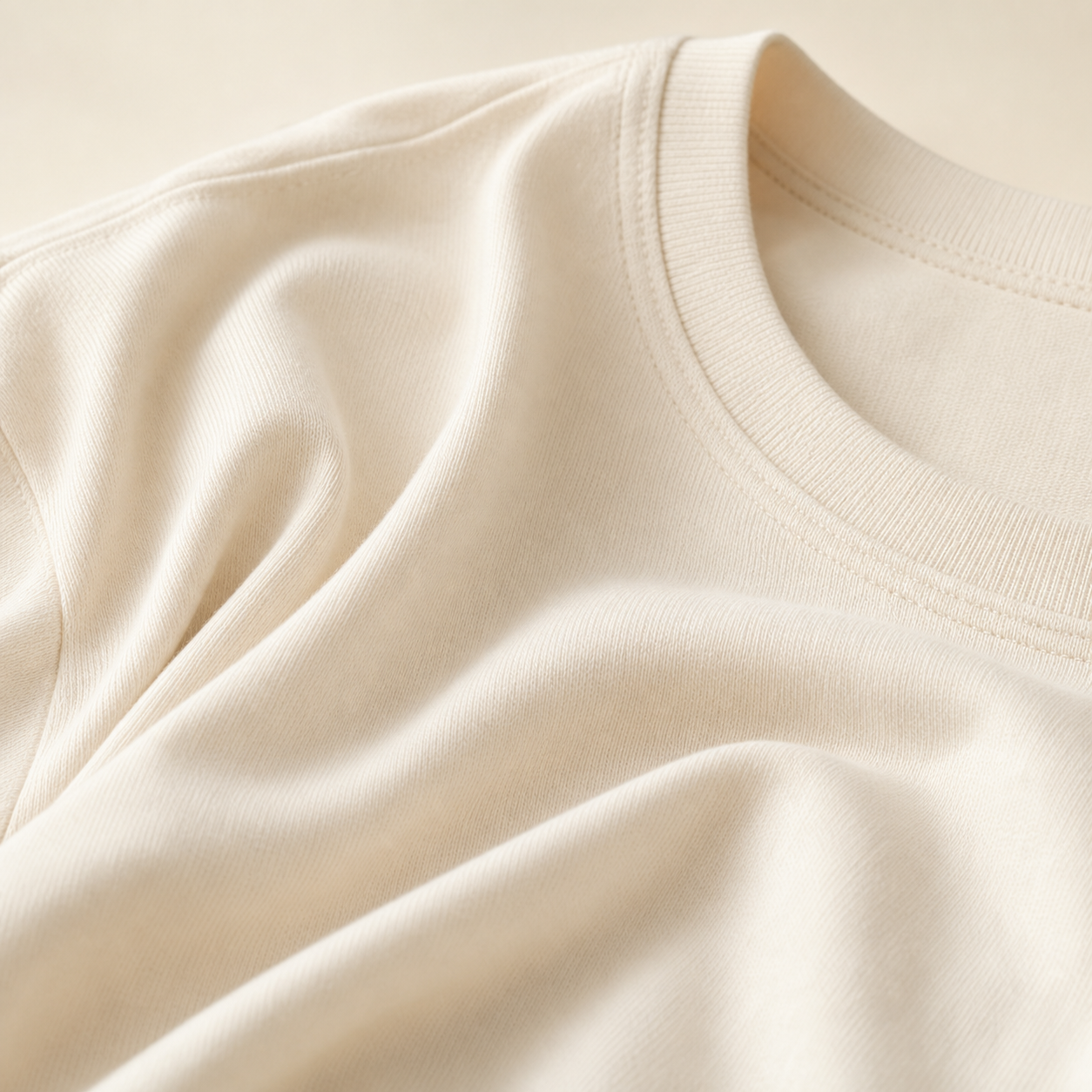 Close-up of the natural cotton fabric and ribbed crew neckline